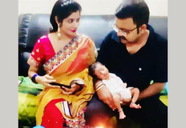 Smriti-Sumit-with-their-baby-boy.png